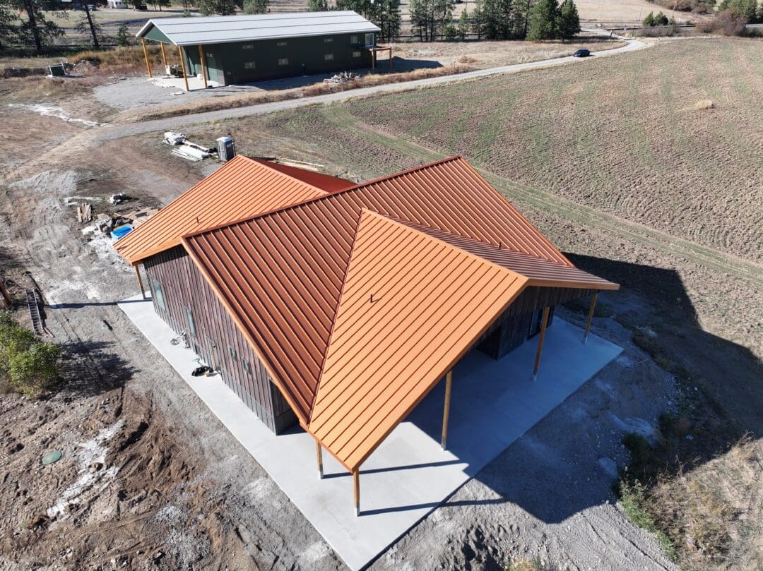 A pole barn with a complex roof