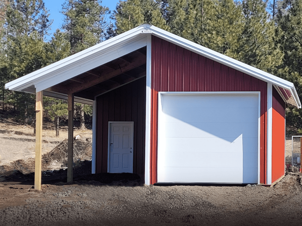 red steel structure pole barn with white trim and white overhang garage door