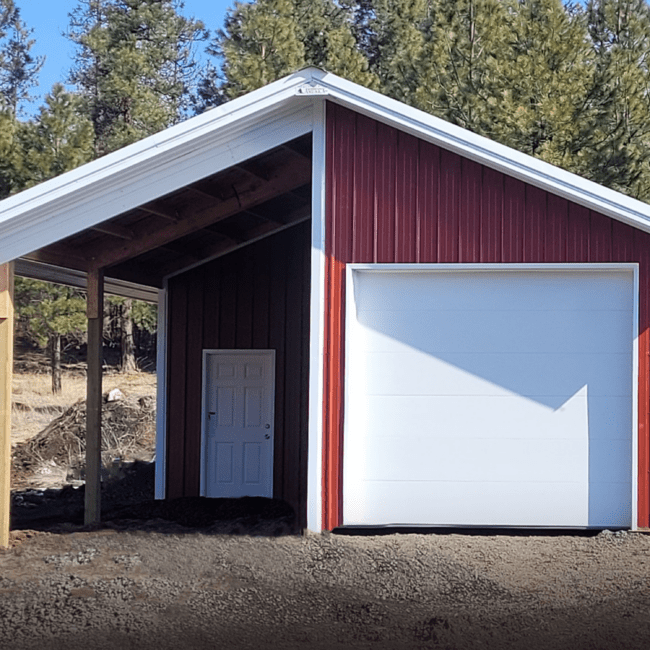 red steel structure pole barn with white trim and white overhang garage door