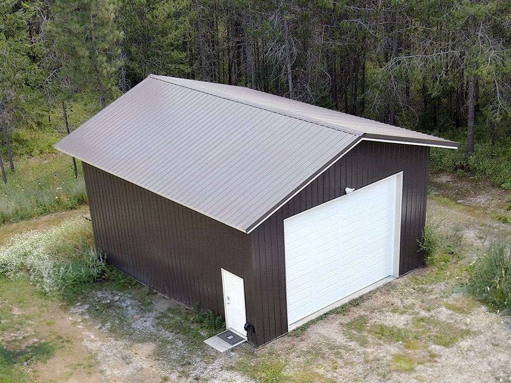 brown 24 x 30 garage with white overhead garage door