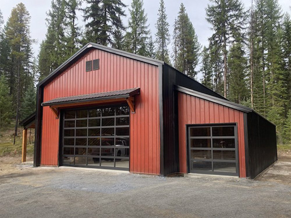 red and brown steel structure garage with glass doors