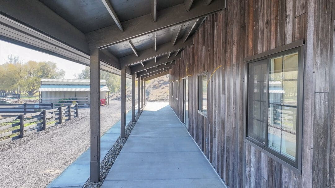 A small lean to on a pole building is used for extra covered storage space