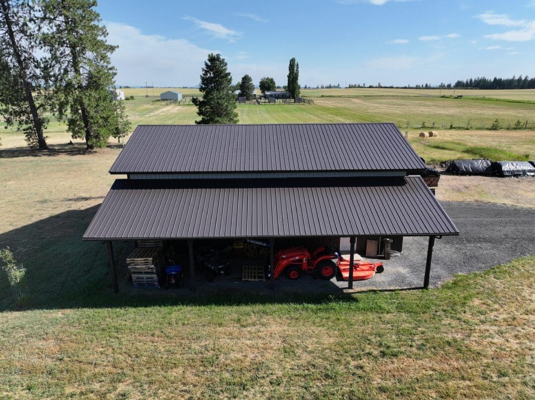 Side view of 30×48×16 post-frame shop with two 12×48 lean-tos in Chattaroy Washington