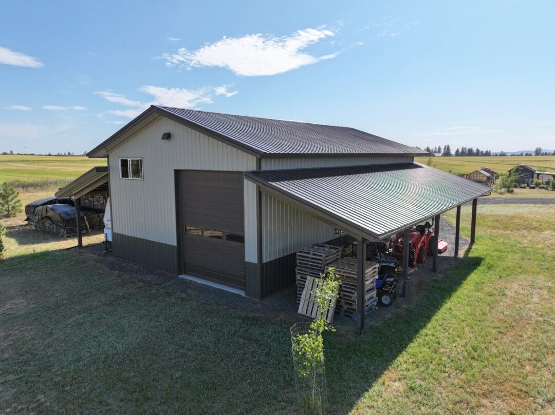 Rear view of 30×48×16 post-frame shop with two 12×48 lean-tos in Chattaroy Washington