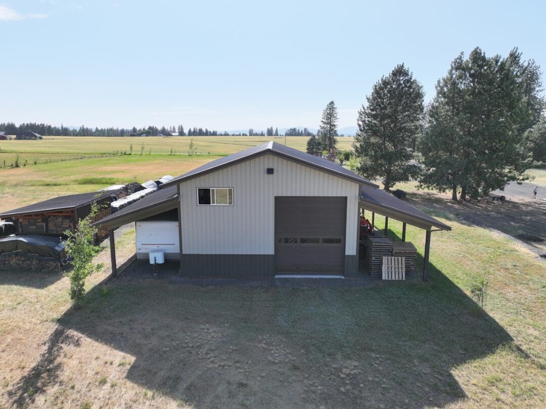 Rear view of 30×48×16 post-frame shop with two 12×48 lean-tos in Chattaroy Washington