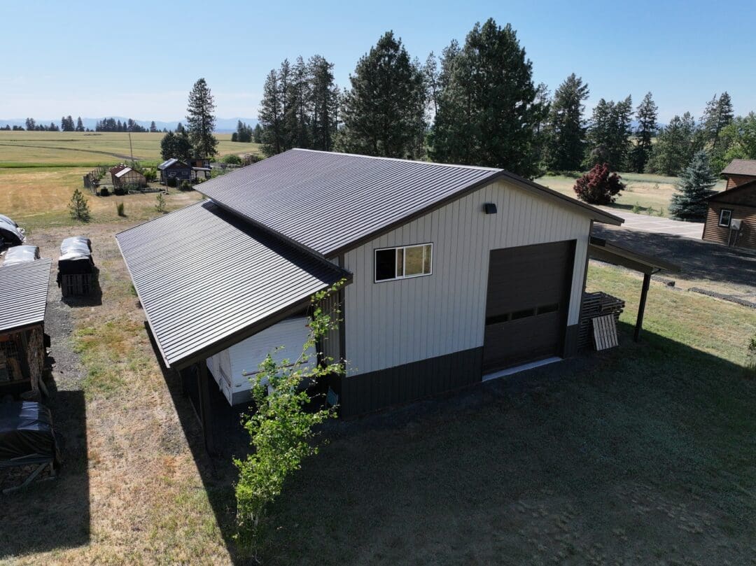 Rear view of 30×48×16 post-frame shop with two 12×48 lean-tos in Chattaroy Washington