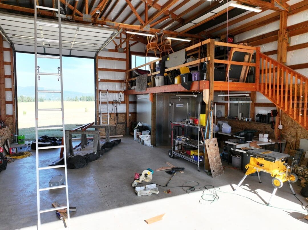 Inside of 30×48×16 Post-Frame Shop with Dual Lean-Tos in Chattaroy WA