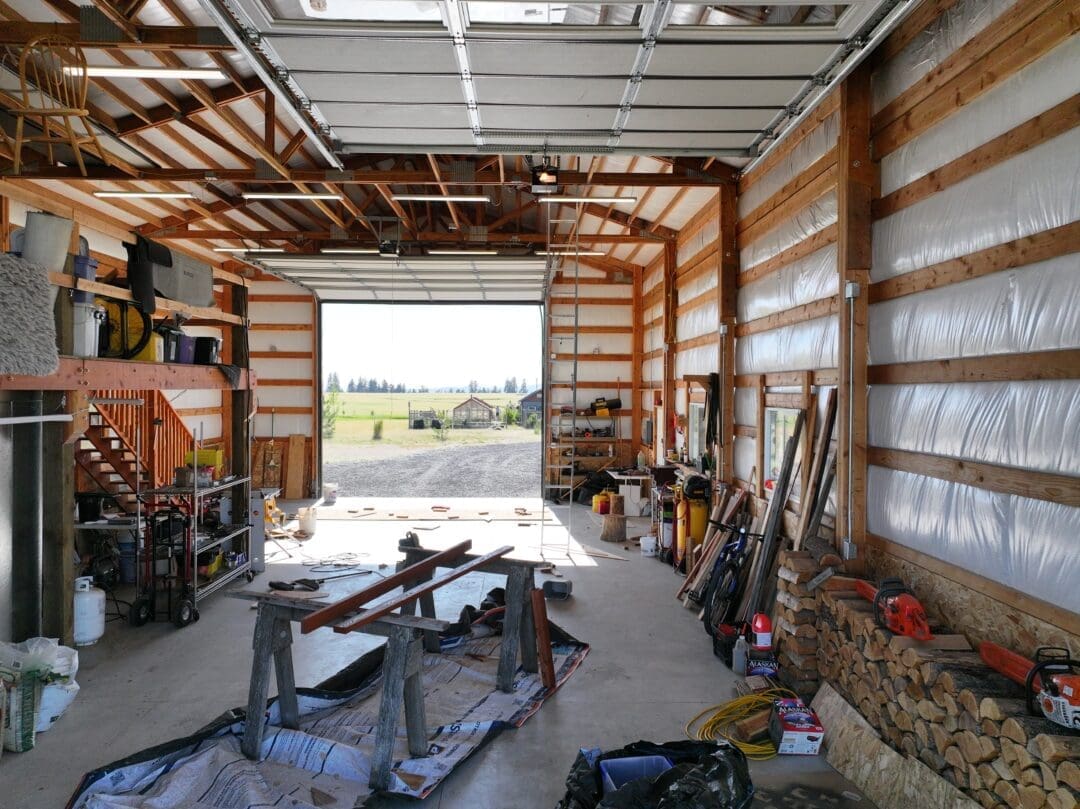 Inside of 30×48×16 Post-Frame Shop with Dual Lean-Tos in Chattaroy WA