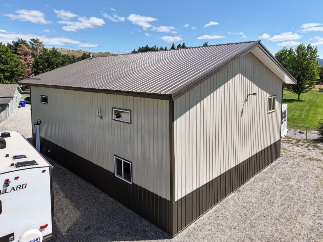 Fixed high-set windows near roofline outside steel shop (12586)