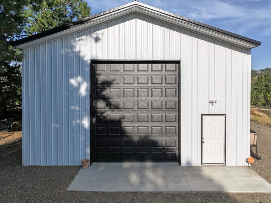 Black trim and Metal America steel roof on residential shop in Spokane