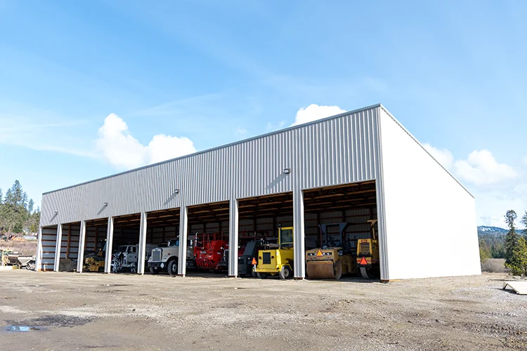 A commercial pole building stores many pieces of large equipment