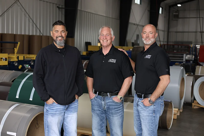 The CEO and COO of Steel Structures America pose with the Manager of Metal America, a subsidiary of SSA