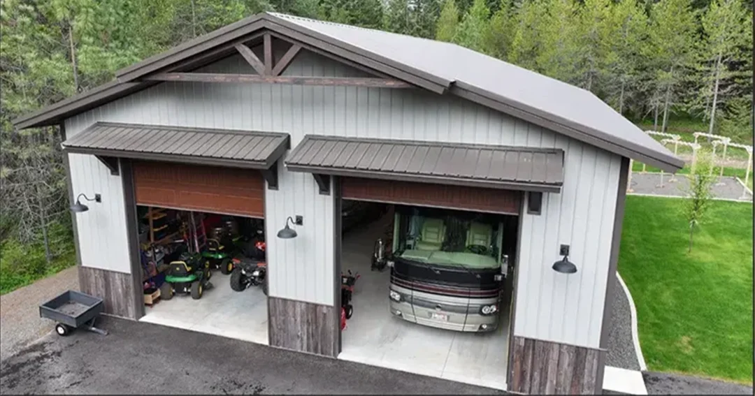 RV in a pole building with its large overhead doors open