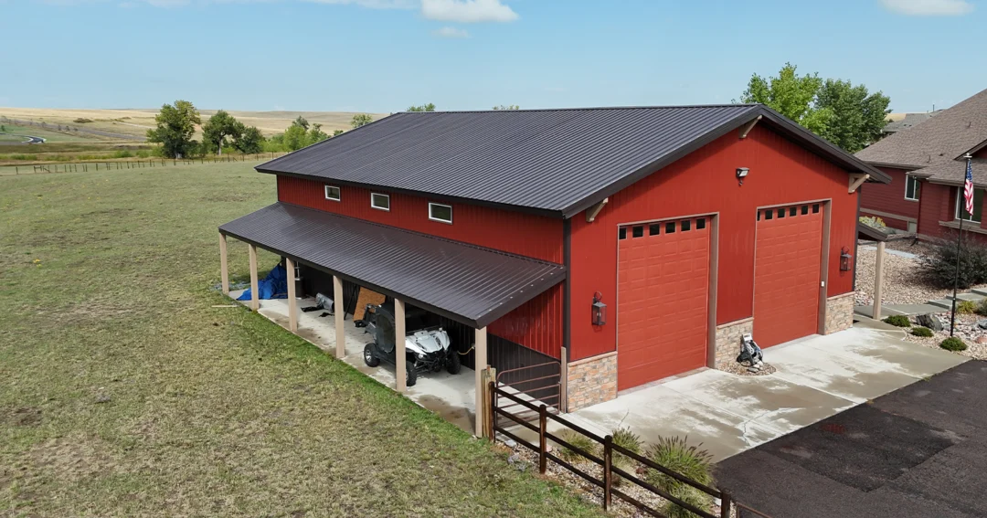 A photo of the result of adding a lean-to to a pole barn