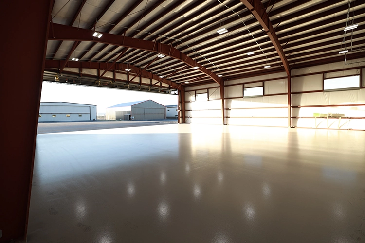 The interior of pole barn with a large concrete floor