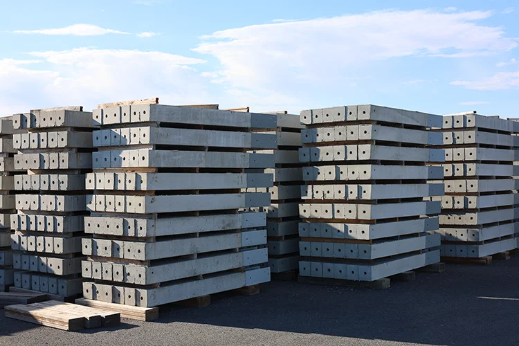 Stacks of various building materials used in post frame construction