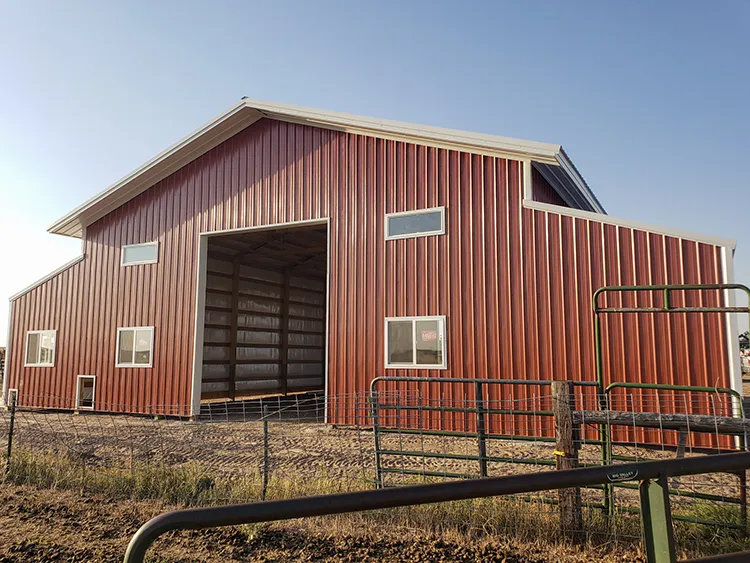 A large red hay barn