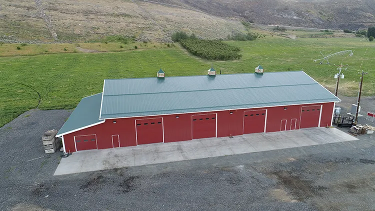 A long red agricultural farm building