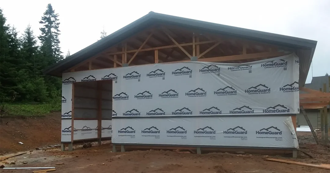 Wokers are doing a pole barn to barndominium conversion