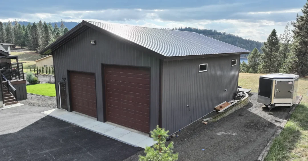 Pole barn cost image of a grey and brown pole barn