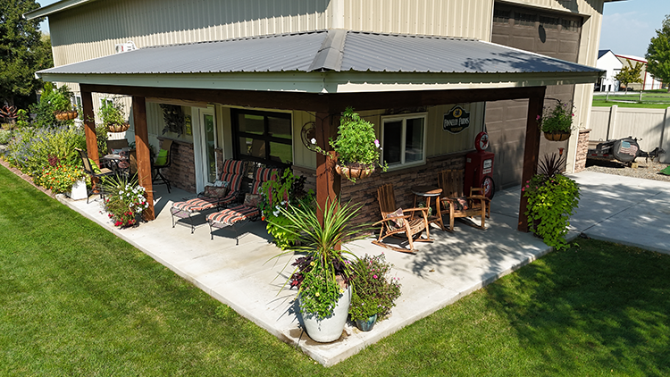 A pole barn has a beautiful lean-to porch and high insulation value windows