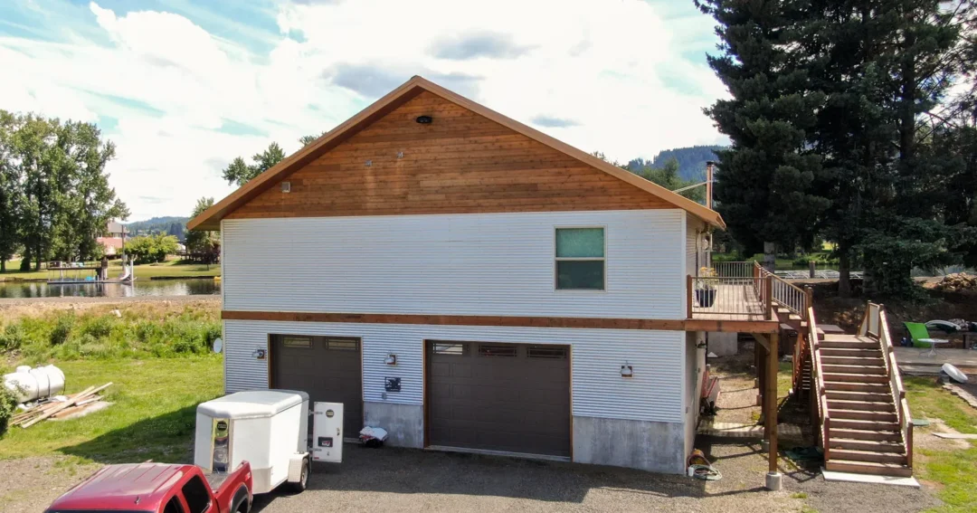 A small white pole-barn barndominium