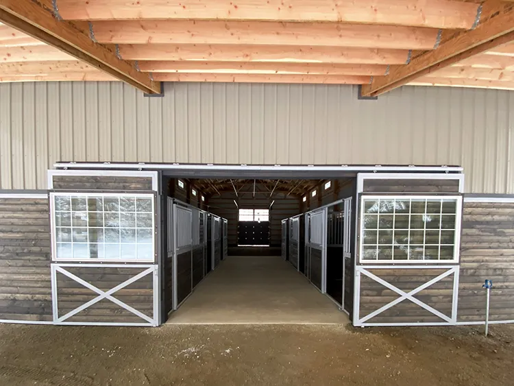 Some small sliding barn doors lead into a stable