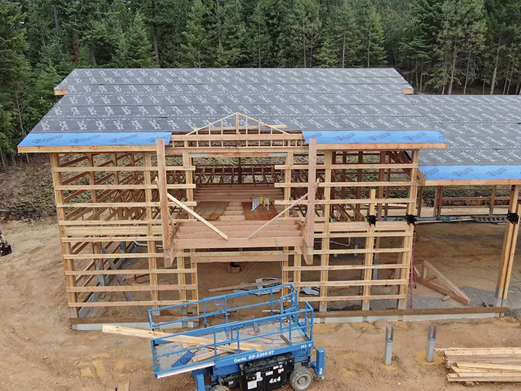 Moisture in a pole barn is controlled with roofing underlayment as seen in this areal photo