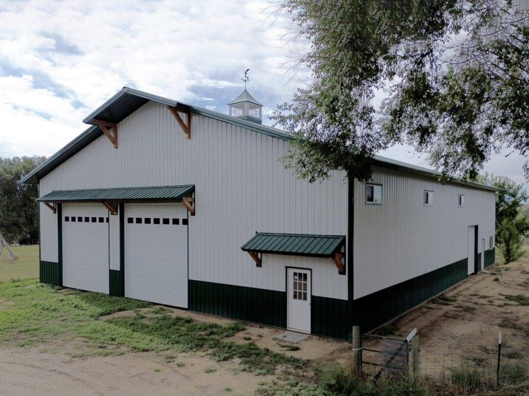 A barn cupola on the roofline of a post-frame building for ventilation and a finished look