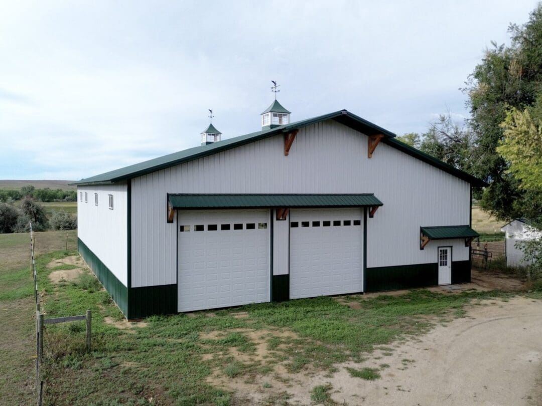 Contrasting wainscoting accents the lower walls of a pole barn