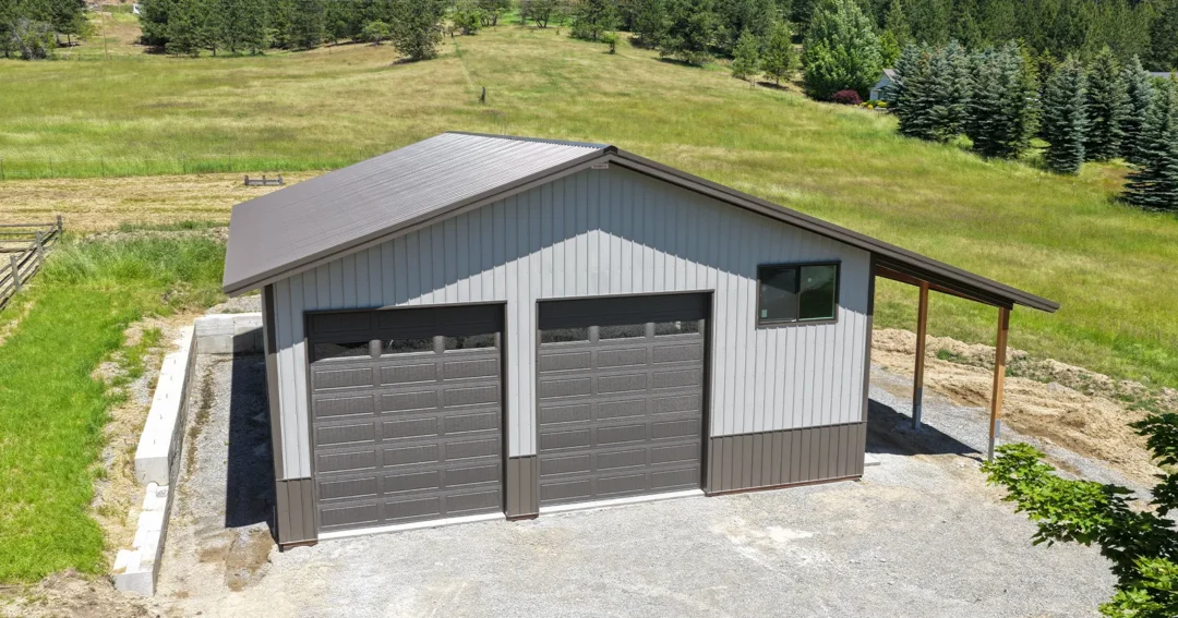 Pole barn wainscoting adds a contrasting band around the base of this two-tone building